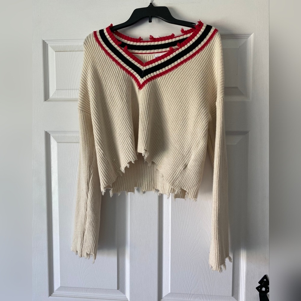 Stylish Cream Sweater with Red and Black Accents